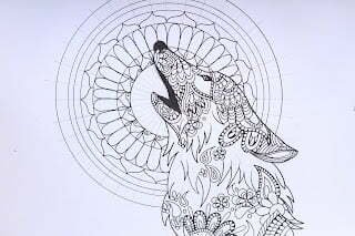 this is the image of a wolf with a mandala behind it