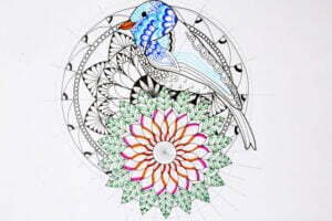 this is the image of a bird with two mandalas in the background