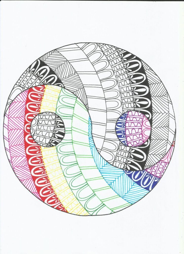 this is the image of a yin yang mandala. black and white on one side and colored on the other