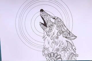 this is the image of a wolf with a mandala behind it