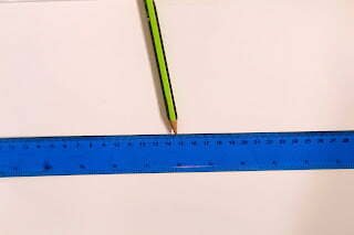 this is an image of a ruler and a pencil
