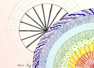 this is the image of a rainbow zentangle and a sun mandala behind it