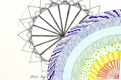 this is the image of a rainbow zentangle and a sun mandala behind it