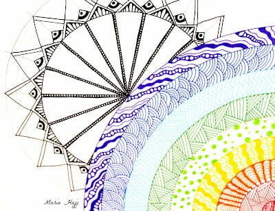 this is the image of a rainbow zentangle and a sun mandala behind it