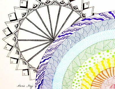 this is the image of a rainbow zentangle and a sun mandala behind it