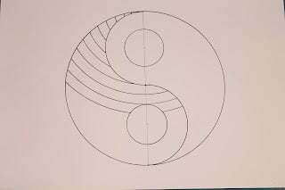 this is the image of a yin yang with a mandala grid on one side