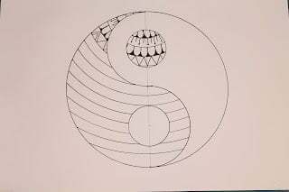 this is the image of a yin yang with a mandala grid on one side