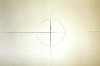 this is the image of a grid dividing the paper into four equal sections and a circle in the center