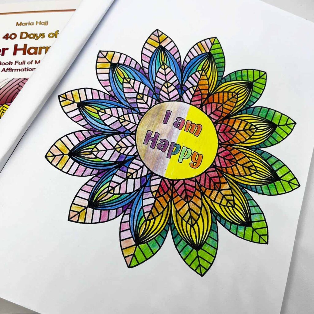 a colored mandala from a mandala coloring book by maria hajj