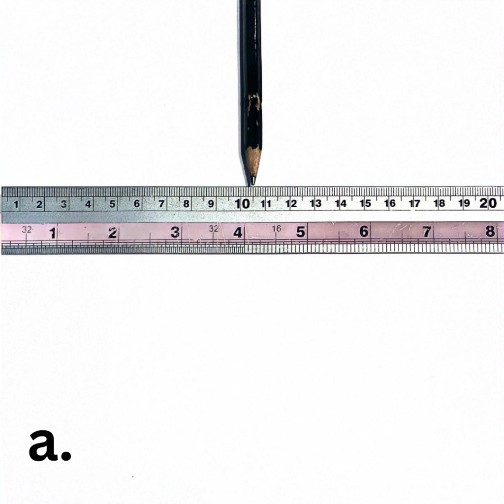 an image with a ruler and a pencil pointing to its center