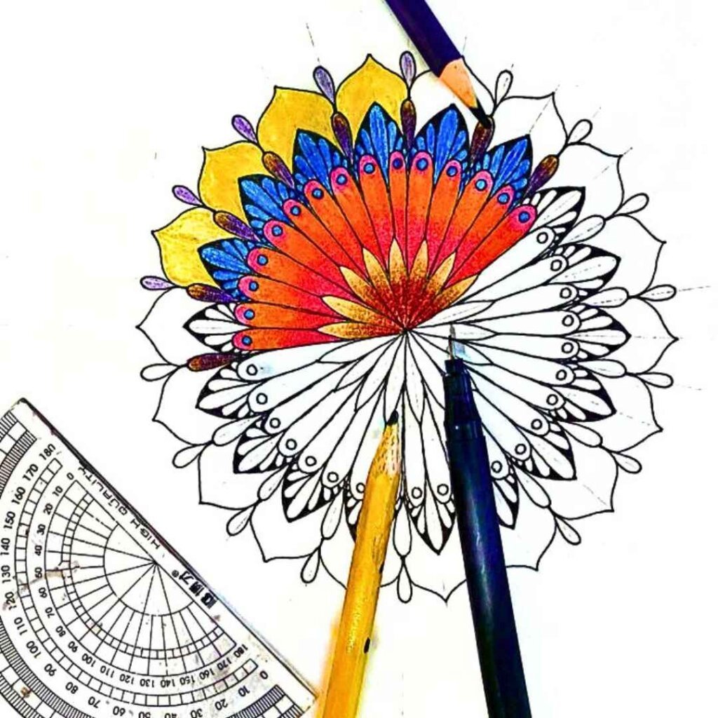 this is the image of a mandala half colored, with a pencil, a drawing pen, and a protractor