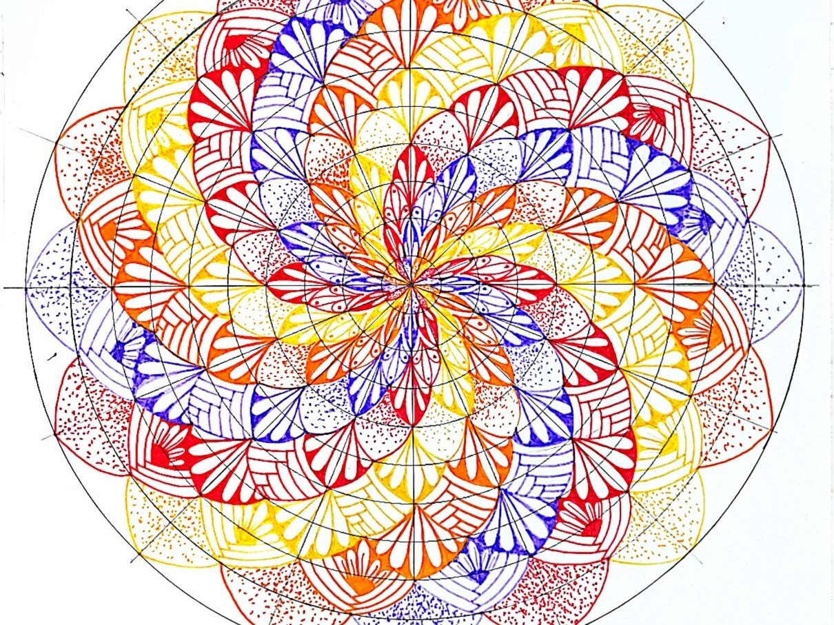 Final step of a twisted mandala tutorial showing the completed mandala with an outer ring of petals filled using the stippling technique.